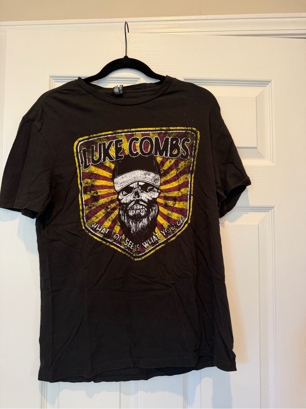 District Black Luke Combs Skull Crest Tee with Yellow & Red Rays